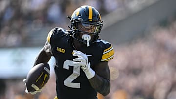 Oct 12, 2024; Iowa City, Iowa, USA; Iowa Hawkeyes running back Kaleb Johnson (2) runs for a 17 yard touchdown run during the second quarter against the Washington Huskies at Kinnick Stadium. Mandatory Credit: Jeffrey Becker-Imagn Images