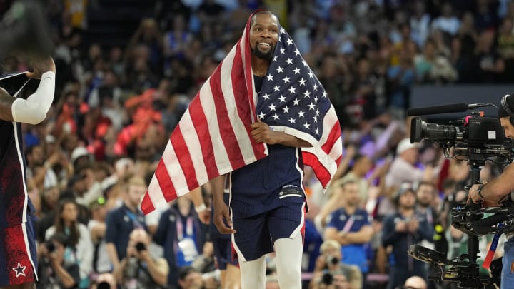 Aug 10, 2024; Paris, France; United States guard Kevin Durant (7) celebrates after defeating France in the men's basketball gold medal game during the Paris 2024 Olympic Summer Games at Accor Arena. Mandatory Credit: Kyle Terada-USA TODAY Sports