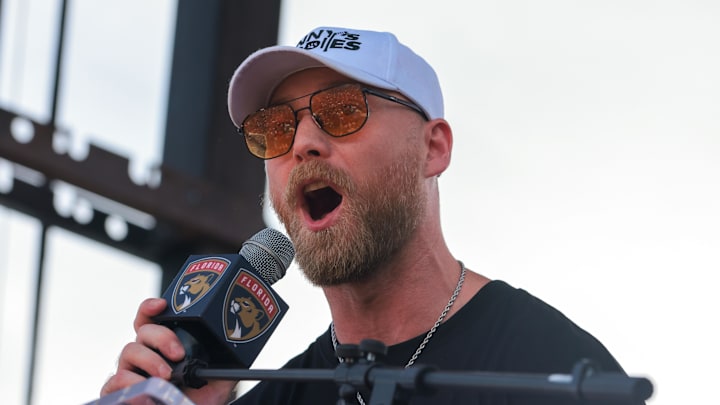 Jun 22, 2025; Fort Lauderdale, Florida, UNITED STATES; Florida Panthers center Sam Bennett (9) speaks to the fans during the Stanley Cup championship parade and rally. Mandatory Credit: Sam Navarro-Imagn Images Jun 22, 2025; Fort Lauderdale, Florida, UNITED STATES; Florida Panthers center Sam Bennett (9) speaks to the fans during the Stanley Cup championship parade and rally. Mandatory Credit: Sam Navarro-Imagn Images