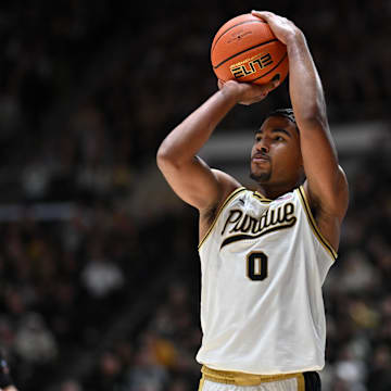 Purdue Boilermakers guard C.J. Cox (0) shoots the ball