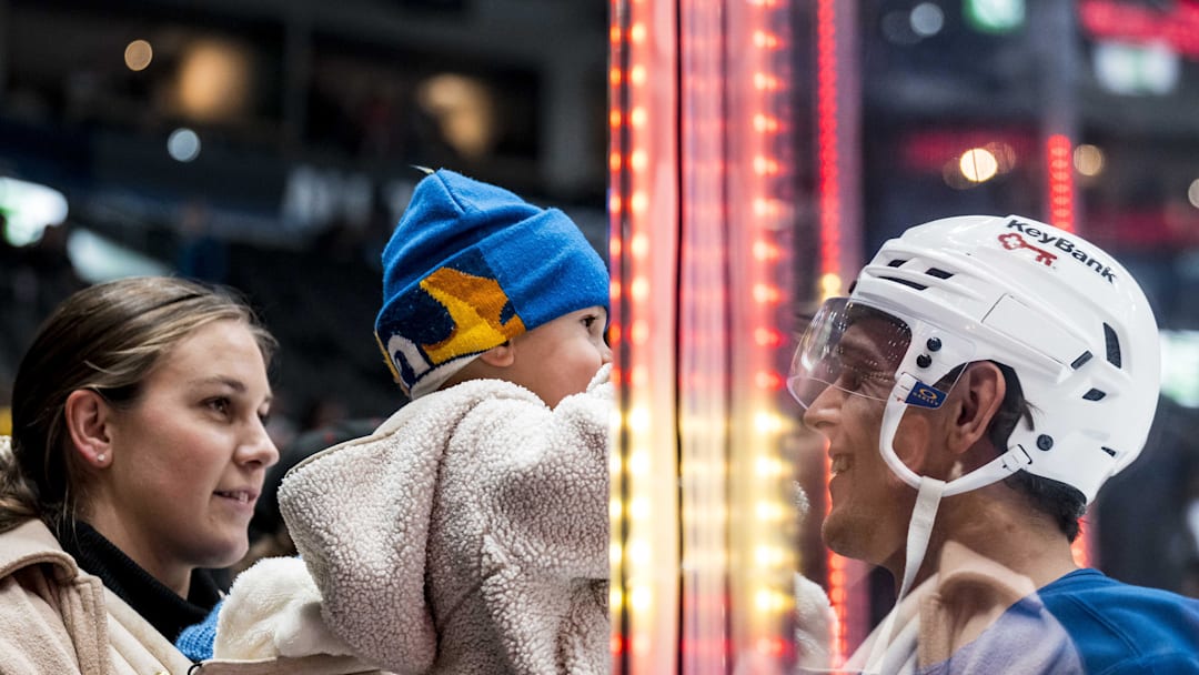 Dec 11, 2025; Vancouver, British Columbia, CAN; Buffalo Sabres forward Beck Malenstyn (29) reacts to a young fan  during warm up prior to a game against the Vancouver Canucks at Rogers Arena. Mandatory Credit: Bob Frid-Imagn Images