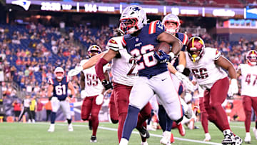 Aug 8, 2025; Foxborough, Massachusetts, USA; New England Patriots running back Terrell Jennings (26) scores a touchdown against the Washington Commanders during the second half at Gillette Stadium. Mandatory Credit: Brian Fluharty-Imagn Images