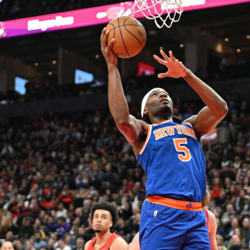 Mar 27, 2024; Toronto, Ontario, CAN;  New York Knicks forward Precious Achiuwa (5) shoots the ball against the Toronto Raptors in the first half at Scotiabank Arena. Mandatory Credit: Dan Hamilton-USA TODAY Sports