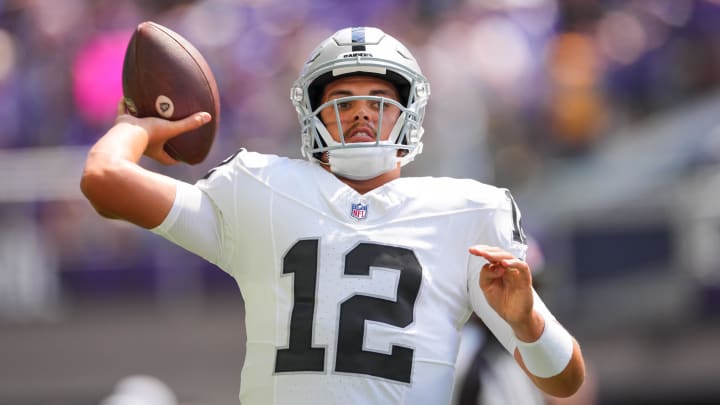 Aug 10, 2024; Minneapolis, Minnesota, USA; Las Vegas Raiders quarterback Aidan O'Connell (12) warms up before the game against the Minnesota Vikings  at U.S. Bank Stadium. Mandatory Credit: Brad Rempel-USA TODAY Sports