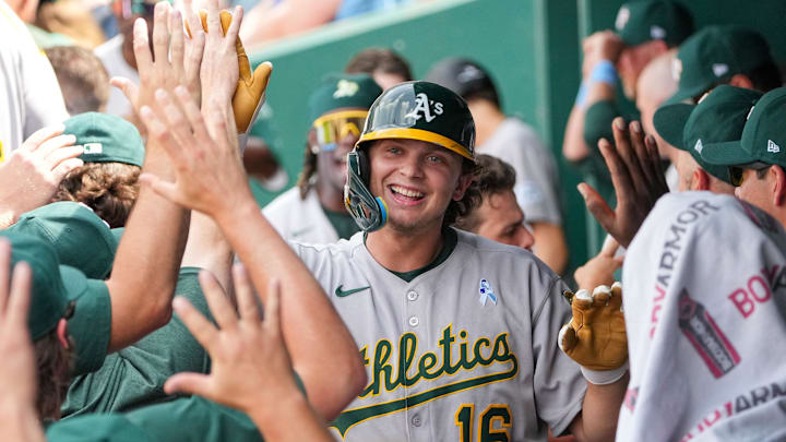 Jun 15, 2025; Kansas City, Missouri, USA; Athletics first base Nick Kurtz (16) is congratulated in the dugout after hitting a solo home run against the Kansas City Royals in the ninth inning at Kauffman Stadium. Mandatory Credit: Denny Medley-Imagn Images Jun 15, 2025; Kansas City, Missouri, USA; Athletics first base Nick Kurtz (16) is congratulated in the dugout after hitting a solo home run against the Kansas City Royals in the ninth inning at Kauffman Stadium. Mandatory Credit: Denny Medley-Imagn Images
