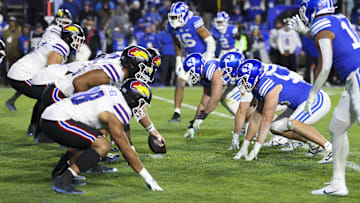 Nov 16, 2024; Provo, Utah, USA; The Kansas Jayhawks offense lines up against the Brigham Young Cougars defense during the fourth quarter at LaVell Edwards Stadium. Mandatory Credit: Rob Gray-Imagn Images