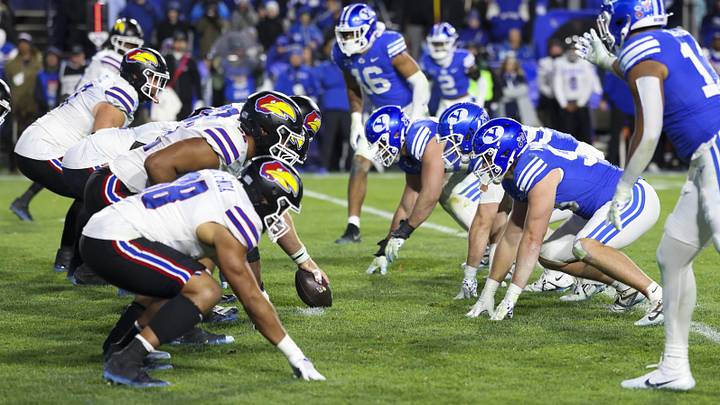 Nov 16, 2024; Provo, Utah, USA; The Kansas Jayhawks offense lines up against the Brigham Young Cougars defense during the fourth quarter at LaVell Edwards Stadium. Mandatory Credit: Rob Gray-Imagn Images