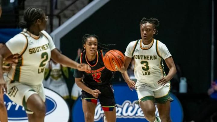 Southern Lab's Asia Patin brings the ball up the court