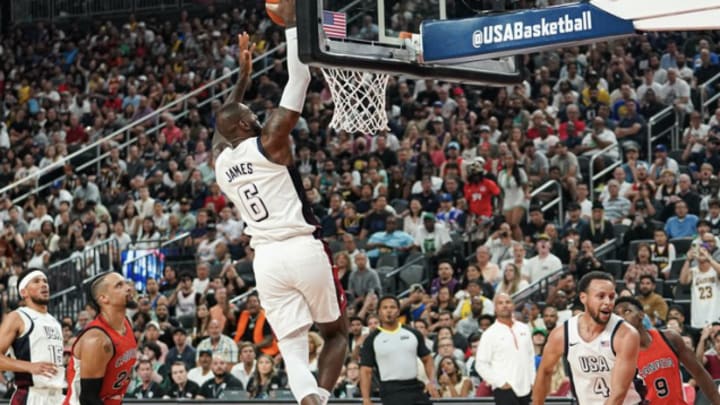 LeBron James (#6) catches an alley-oop pass from teammate Stephen Curry (#4) during Team USA's win over Team Canada in an Olympics basketball exhibition on Wednesday night at T-Mobile Arena in Las Vegas, Nev. 