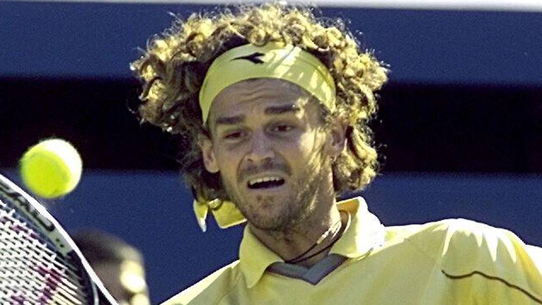 Gustavo Kuerten hits a shot at the French Open