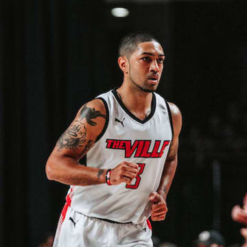 The Ville guards Peyton Siva (3) and Russ Smith (6)