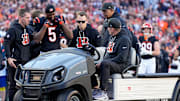 Cincinnati Bengals wide receiver Tee Higgins (5) is carted off of the field after suffering a concussion on a play in the fourth quarter of the NFL Week 12 game between the Cincinnati Bengals and the New England Patriots at Paycor Stadium in downtown Cincinnati on Sunday, Nov. 23, 2025. The Bengals fall to 3-8 with a 26-20 loss at home.