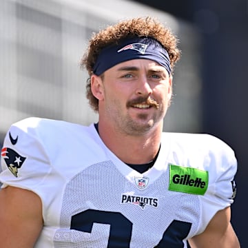 Jul 28, 2025; Foxborough, MA, USA; New England Patriots running back Lan Larison (34) heads to the practice fields for training camp at Gillette Stadium. Mandatory Credit: Eric Canha-Imagn Images