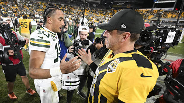 Jordan Love and Aaron Rodgers meet after playing against each other.