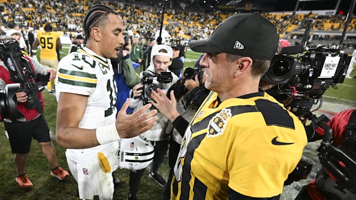 Rodgers and Love shake hands after the game at Acrisure Stadium. Rodgers and Love shake hands after the game at Acrisure Stadium.