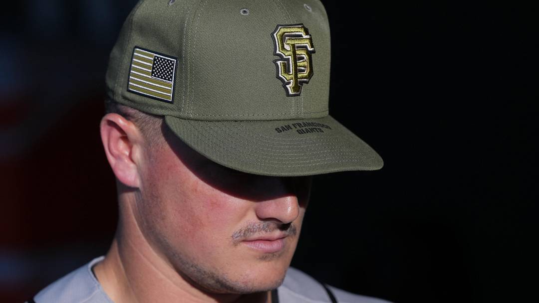 May 16, 2026; West Sacramento, California, USA; San Francisco Giants third baseman Matt Chapman (26) wears a hat as part of Armed Forces Day before the game against the Athletics at Sutter Health Park. Mandatory Credit: Darren Yamashita-Imagn Images