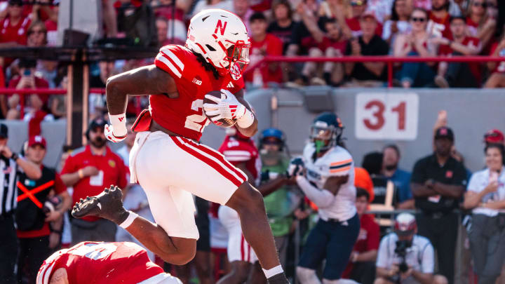 Aug 31, 2024; Lincoln, Nebraska, USA; Nebraska Cornhuskers running back Gabe Ervin Jr. (22) runs for a touchdown against the UTEP Miners during the third quarter at Memorial Stadium.