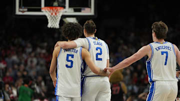 Apr 5, 2025; San Antonio, TX, USA; Duke basketball guard Tyrese Proctor (5), forward Cooper Flagg (2), and guard Kon Knueppel (7) console each other late in the second half in the semifinals of the men's Final Four of the 2025 NCAA Tournament at the Alamodome. 