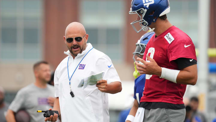 Jul 25, 2024; East Rutherford, NY, USA; New York Giants head coach Brian Daboll speaks with quarterback Daniel Jones (8) during training camp at Quest Diagnostics Training Center. Mandatory Credit: Lucas Boland-USA TODAY Sports