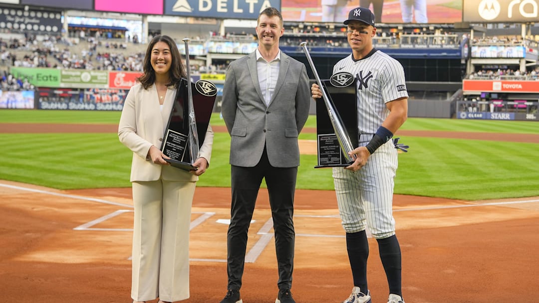 Apr 14, 2025; Bronx, New York, USA; New York Yankees right fielder Aaron Judge (99) receives his Sliver Slugger Award from the representatives from Louisville Slugger prior to the game against the Kansas City Royals at Yankee Stadium. 