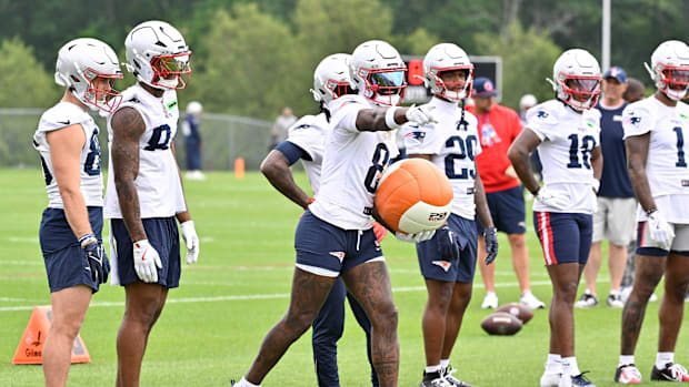 New England Patriots wide receiver Stefon Diggs (8) does a drill with a training aid during minicamp at Gillette Stadium.
