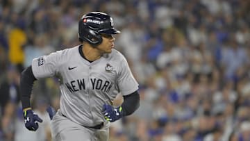 Oct 25, 2024; Los Angeles, California, USA; New York Yankees outfielder Juan Soto (22) hits a single in the sixth inning against the Los Angeles Dodgers during game one of the 2024 MLB World Series at Dodger Stadium. Mandatory Credit:  Jayne Kamin-Oncea-Imagn Images
