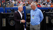 Big 12 commissioner is Brett Yormark, left, and SEC commissioner Greg Sankey talk before Game 1 of the Women's College World Series championship series between the Texas Longhorns at Texas Tech Red Raiders at Devon Park in Oklahoma City, Wednesday, June 4, 2025. Texas won 2-1.