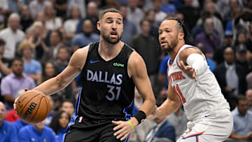 Nov 19, 2025; Dallas, Texas, USA; Dallas Mavericks guard Klay Thompson (31) drives to the basket past New York Knicks guard Jalen Brunson (11) during the first quarter at the American Airlines Center. Mandatory Credit: Jerome Miron-Imagn Images