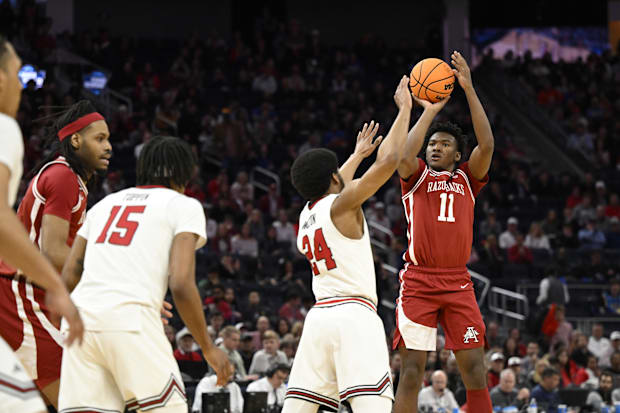 Arkansas forward Karter Knox shoots a three-point basket over Texas Tech guard Kerwin Walton.