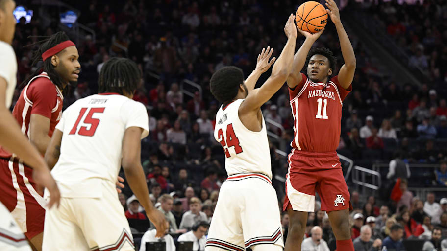 Arkansas forward Karter Knox shoots a three-point basket over Texas Tech guard Kerwin Walton.