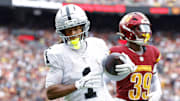 Sep 21, 2025; Landover, Maryland, USA; Las Vegas Raiders wide receiver Tre Tucker (1) celebrates after scoring a touchdown during the second half against the Washington Commanders at Northwest Stadium. Mandatory Credit: Amber Searls-Imagn Images