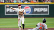 Apr 8, 2025; Phoenix, Arizona, USA; Arizona Diamondbacks outfielder Garrett Hampson (8) throws to first for a double play after forcing out Baltimore Orioles outfielder Cedric Mullins (31) at second base during the first inning at Chase Field. Mandatory Credit: Joe Camporeale-Imagn Images