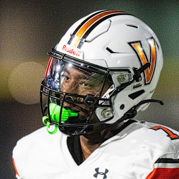 Valley's Jayden McGregory (7) looks to the Southeast Polk sideline after a stop on thrid down on Friday, Aug. 30, 2024, at Southeast Polk Stadium.
