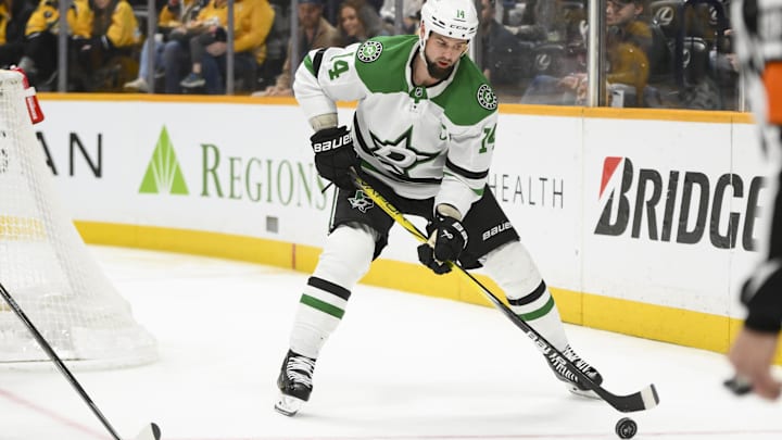 Apr 16, 2025; Nashville, Tennessee, USA;  Dallas Stars left wing Jamie Benn (14) skates with the puck against the Nashville Predators during the second period at Bridgestone Arena. Mandatory Credit: Steve Roberts-Imagn Images