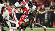 Northern Illinois Huskies running back Chavon Wright (10) breaks free from the tackle of Maryland Terrapins linebacker Trey Reddick (3) for a first down in the first half at SECU Stadium.