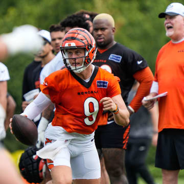 Bengals Joe Burrow looks for a pass during their training camp on Thursday July 29, 2024.