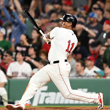 May 17, 2025; Boston, Massachusetts, USA; Boston Red Sox designated hitter Rafael Devers (11) hits a walk off home run against the Atlanta Braves during the ninth inning at Fenway Park. Mandatory Credit: Brian Fluharty-Imagn Images