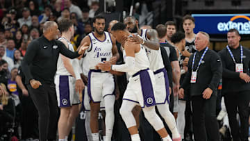 Nov 26, 2022; San Antonio, Texas, USA;  Los Angeles Lakers forward LeBron James (6) holds guard Russell Westbrook (0) after Westbrook was fouled by San Antonio Spurs forward Zach Collins (23) in the second half at the AT&T Center. Mandatory Credit: Daniel Dunn-Imagn Images