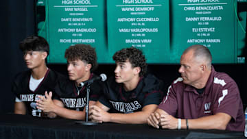 From left, Wayne Hills’ Braden Viray, Vasili Vasilopoulos, Anthony Cuccinello, and head coach Wayne Demikoff sit down for a panel during Super Football Conference Media Day at MetLife Stadium on Tuesday, Aug. 19, 2025.