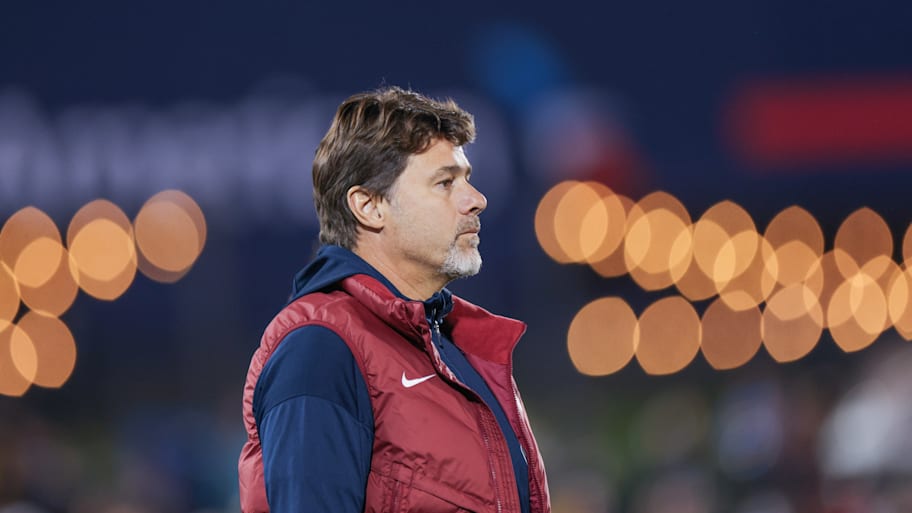 Mauricio Pochettino looking to the side.