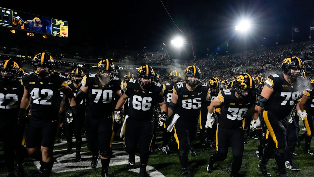 The Iowa Hawkeyes swarm into the tunnel after defeating the Nebraska Cornhuskers 13-10 Friday, Nov. 29, 2024 at Kinnick Stadium in Iowa City, Iowa.