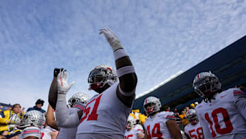 Nov. 25, 2023; Ann Arbor, Mi., USA;
 Ohio State Buckeyes defensive tackle Mike Hall Jr. (51) holds
