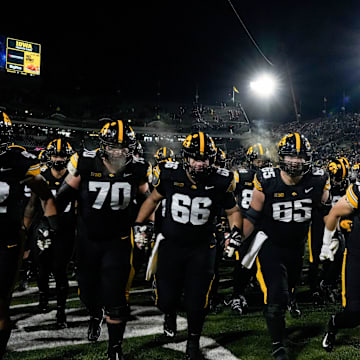 The Iowa Hawkeyes swarm into the tunnel after defeating the Nebraska Cornhuskers 13-10 Friday, Nov. 29, 2024 at Kinnick Stadium in Iowa City, Iowa.