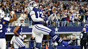 Dallas Cowboys linebacker DeMarvion Overshown celebrates his interception touchdown return.