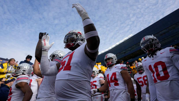 Nov. 25, 2023; Ann Arbor, Mi., USA; Ohio State Buckeyes defensive tackle Mike Hall Jr. (51) holds up his hands in an   O   a