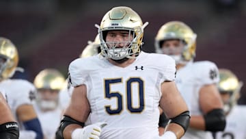 Notre Dame offensive lineman Rocco Spindler (50) jogs on the field before the game against the Stanford Cardinal at Stanford Stadium. 