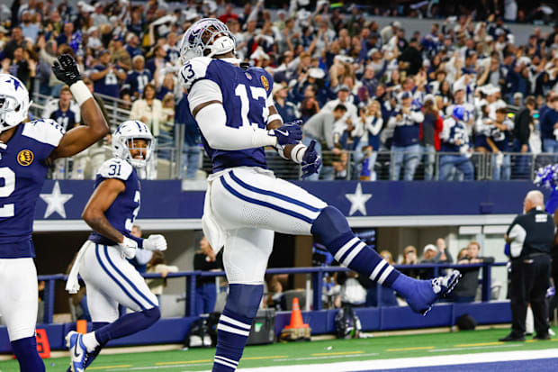 Dallas Cowboys LB DeMarvion Overshown celebrates his interception touchdown return against the New York Giants.