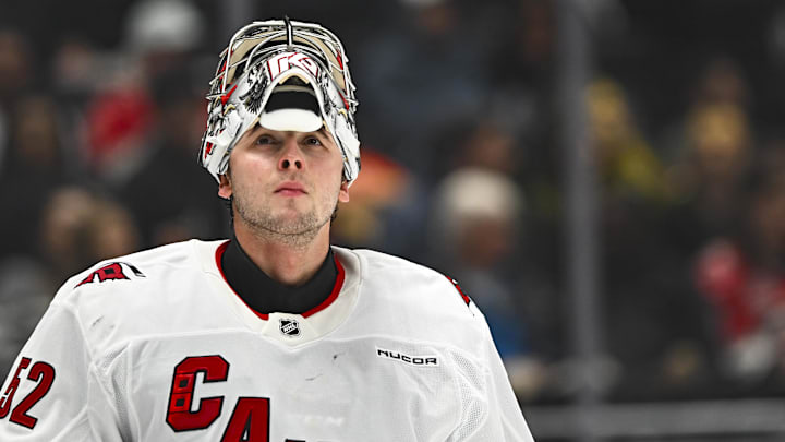 Mar 22, 2025; Los Angeles, California, USA; Carolina Hurricanes goaltender Pyotr Kochetkov (52) with his mask off against the Los Angeles Kings during the second period at Crypto.com Arena. Mandatory Credit: Jonathan Hui-Imagn Images