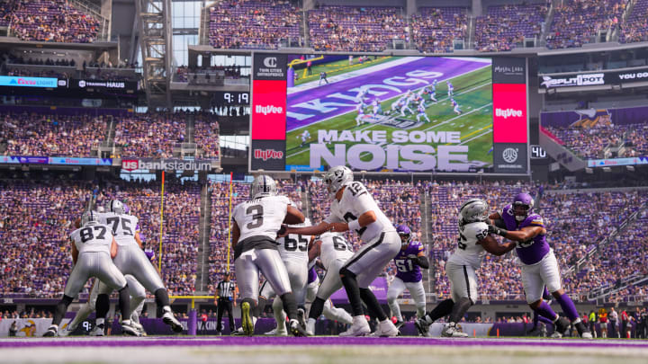 Aug 10, 2024; Minneapolis, Minnesota, USA; Las Vegas Raiders quarterback Aidan O'Connell (12) hands the ball off to running back Zamir White (3) against the Minnesota Vikings in the first quarter at U.S. Bank Stadium. Mandatory Credit: Brad Rempel-USA TODAY Sports