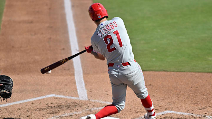 Feb 28, 2026; Dunedin, Florida, USA; Philadelphia Phillies catcher Garrett Stubbs (21) hits into a fielders choice  in the third inning against the Toronto Blue Jays during spring training at TD Ballpark. Mandatory Credit: Jonathan Dyer-Imagn Images